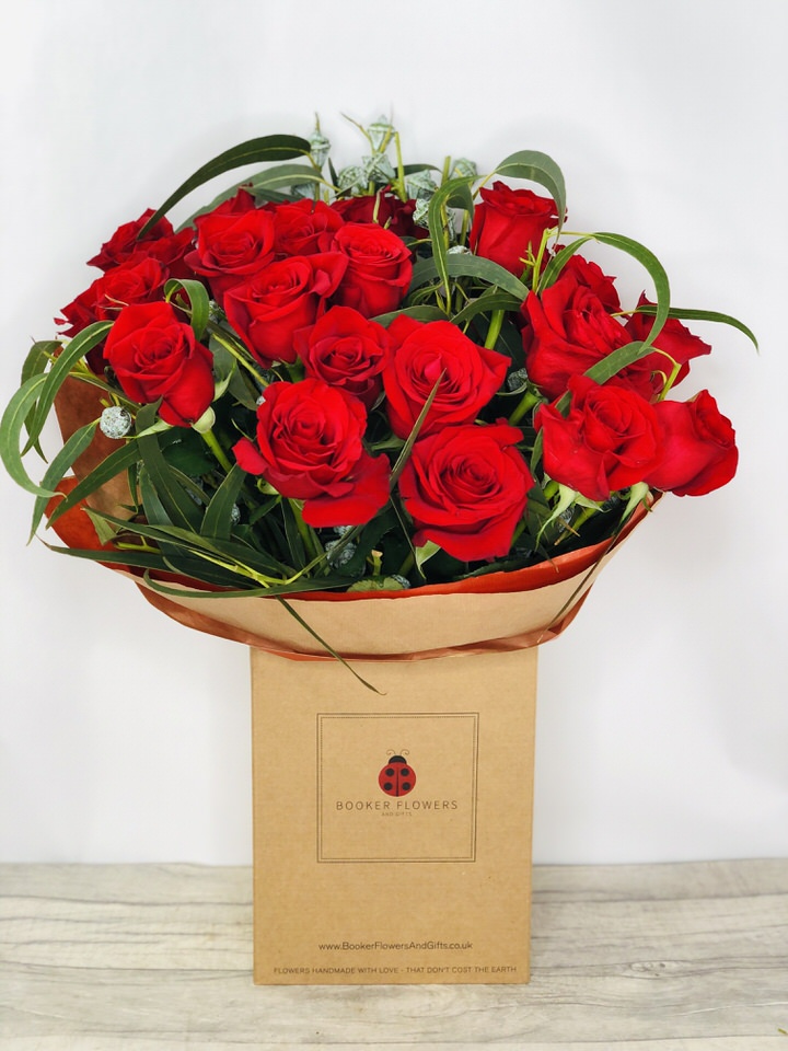 <h2>Two Dozen Red Roses - Handtied Bouquet</h2>
<br>
<ul>
<li>Approximate Dimensions: 55cm x 50cm</li>
<li>Flowers arranged by hand and gift wrapped in our signature eco-friendly packaging and finished off with a hidden wooden ladybird</li>
<li>To give you the best occasionally we may make substitutes</li>
<li>Our flowers backed by our 7 days freshness guarantee</li>
<li>For delivery area coverage see below</li>
</ul>
<br>
<h2>Flower Delivery Coverage</h2>
<p>Our shop delivers flowers to the following Liverpool postcodes L1 L2 L3 L4 L5 L6 L7 L8 L11 L12 L13 L14 L15 L16 L17 L18 L19 L24 L25 L26 L27 L36 L70 If your order is for an area outside of these we can organise delivery for you through our network of florists. We will ask them to make as close as possible to the image but because of the difference in stock and sundry items it may not be exact.</p>
<br>
<h2>Hand-tied Bouquet | 24 Red Roses</h2>
<p>These beautiful roses hand-arranged by our professional florists into a hand-tied bouquet are a delightful choice. This bouquet of two dozen red roses would make the perfect gift or to celebrate an Anniversary.</p>
<p>Handtied bouquets are a lovely display of fresh flowers that have the wow factor. The advantage of having a bouquet made this way is that they are artfully arranged by our florists and tied so that they stay in the display.</p>
<p>They are then gift wrapped and aqua packed in a water bubble so that at no point are the flowers out of water. This means they look their very best on the day they arrive and continue to delight for days after.</p>
<p>Being delivered in a transporter box and in water means the recipient does not need to put the flowers in a vase straight away they can just put them down and enjoy.</p>
<p>Featuring 24 large-headed red roses together with mixed seasonal foliages.</p>
<br>
<h2>Eco-Friendly Liverpool Florists</h2>
<p>As florists we feel very close earth and want to protect it. Plastic waste is a huge problem in the florist industry so we made the decision to make our packaging eco-friendly.</p>
<p>To achieve this we worked with our packaging supplier to remove the lamination off our boxes and wrap the tops in an Eco Flowerwrap which means it easily compostable or can be fully recycled.</p>
<p>Once you have finished enjoying your flowers from us they will go back into growing more flowers! Only a small amount of plastic is used as a water bubble and this is biodegradable.</p>
<p>Even the sachet of flower food included with your bouquet is compostable.</p>
<p>All our bouquets have small wooden ladybird hidden amongst them so do not forget to spot the ladybird and post a picture on our social media pages to enter our rolling competition.</p>
<br>
<h2>Flowers Guaranteed for 7 Days</h2>
<p>Our 7-day freshness guarantee should give you confidence that we will only send out good quality flowers.</p>
<p>Leave it in our hands we will create a marvellous bouquet which will not only look good on arrival but will continue to delight as the flowers bloom.</p>
<br>
<h2>Liverpool Flower Delivery</h2>
<p>We are open 7 days a week and offer advanced booking flower delivery same-day flower delivery 3-hour flower delivery. Guaranteed AM PM or Evening Flower Delivery and also offer Sunday Flower Delivery.</p>
<p>Our florists deliver in Liverpool and can provide flowers for you in Liverpool Merseyside. And through our network of florists can organise flower deliveries for you nationwide.</p>
<br>
<h2>The Best Florist in Liverpool your local Liverpool Flower Shop</h2>
<p>Come to Booker Flowers and Gifts Liverpool for your beautiful flowers and plants. For that bit of extra luxury we also offer a lovely range of finishing touches such as wines champagne locally crafted Gin and Rum Vases Scented Candles and Chocolates that can be delivered with your flowers.</p>
<p>To see the full range see our extras section.</p>
<p>You can trust Booker Flowers and Gifts of delivery the very best for you.</p>
<p><br /><br /></p>
<p><em>5 Star review on Yell.com</em></p>
<br>
<p><em>Thank you Gemma for your fabulous service. The flowers are of the highest quality and delivered with a warm smile. My sister was delighted. Ordering was simple and the communications were top-notch. I will definitely use your services again.</em></p>
